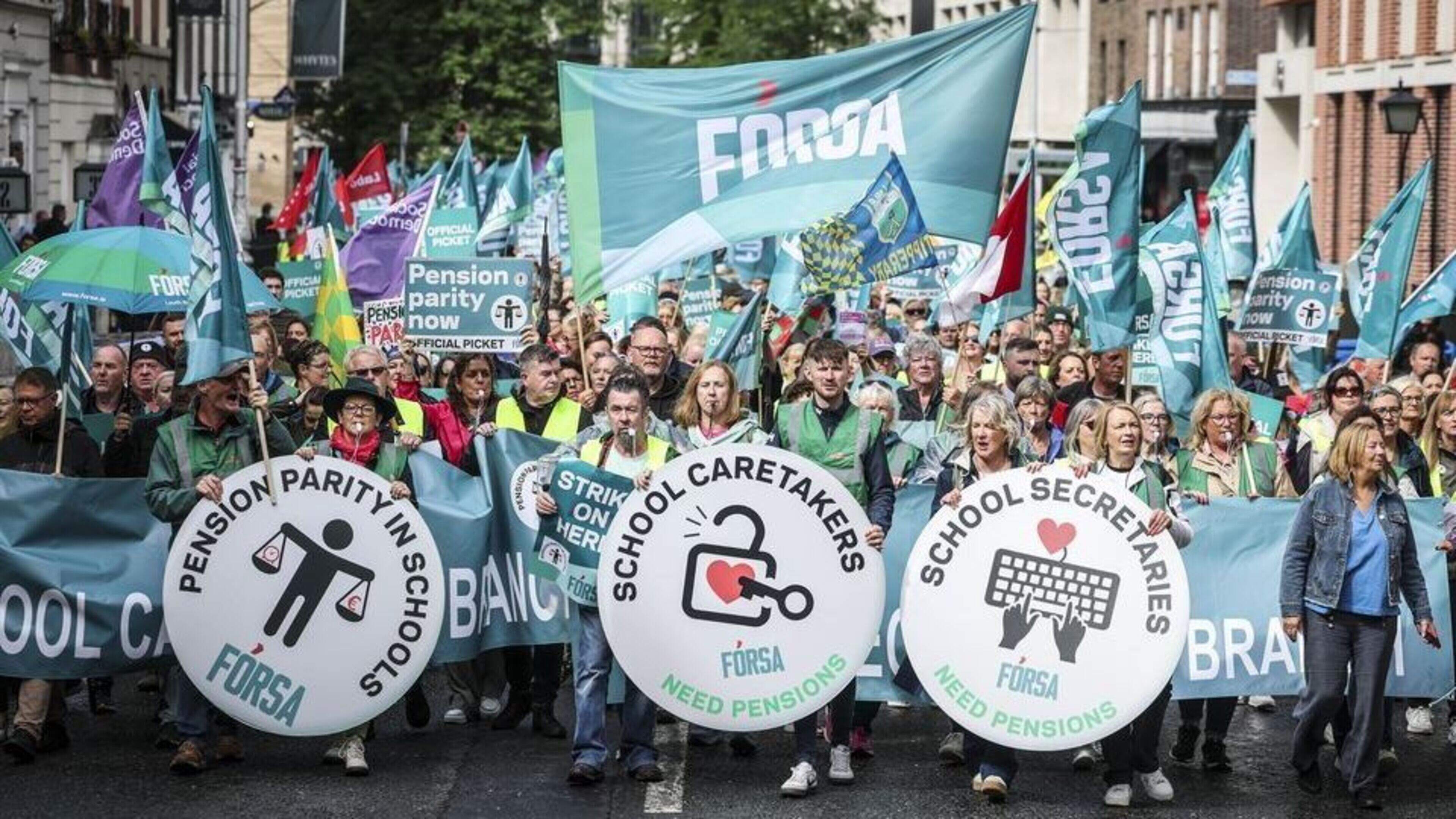 School secretaries and caretakers back pay and conditions deal by 94pc after strike campaign